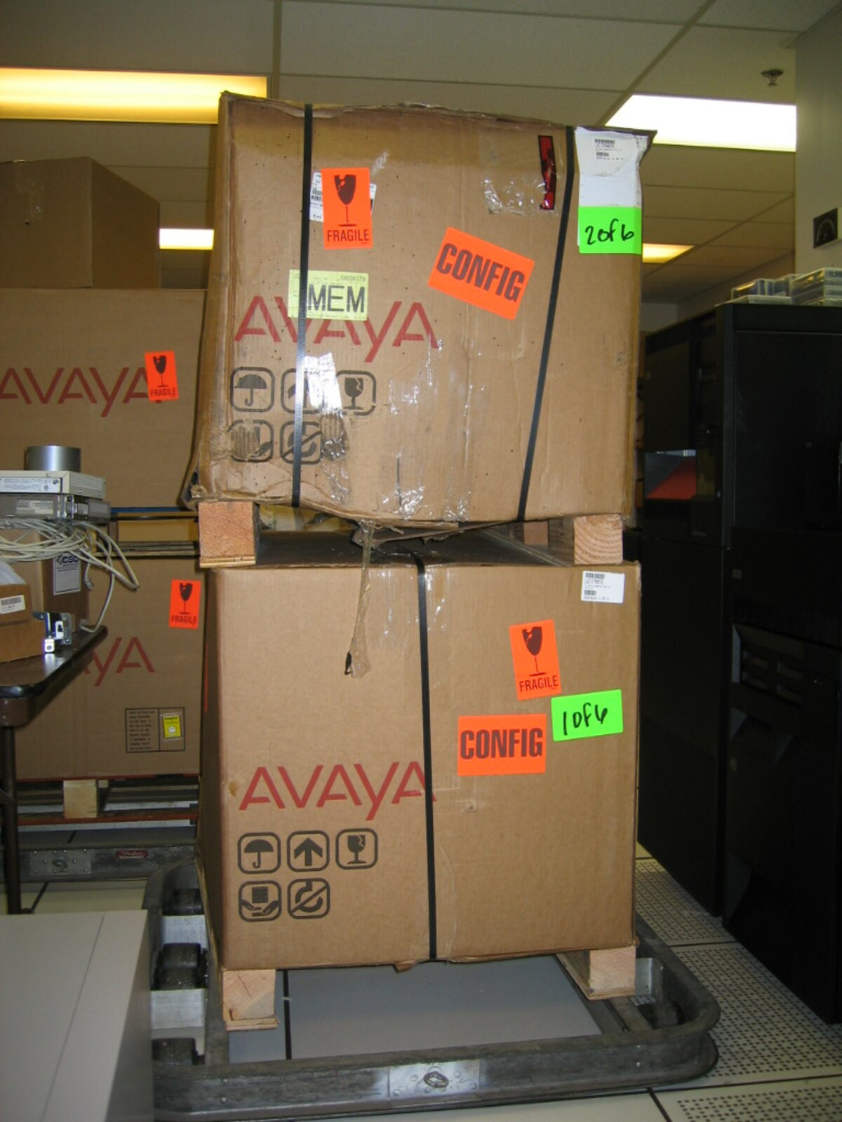 Boxed Avaya phone system equipment delivered to a data center for installation